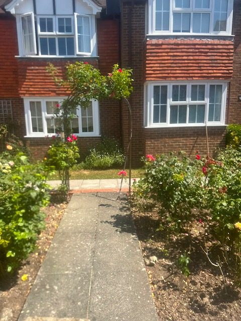 Rose archway over a garden path