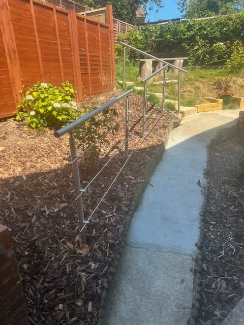 New steps with handrail and mulched border